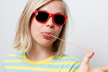 Image showing Girl playing with gum