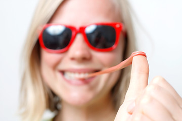 Image showing Girl playing with gum