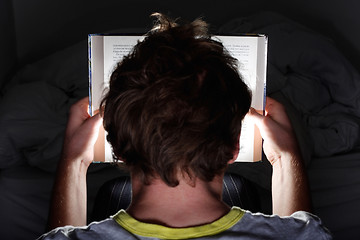 Image showing Reading at night