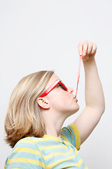 Image showing Girl playing with gum