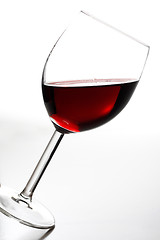Image showing Tilted red wine