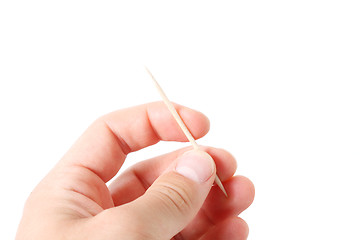 Image showing Hand holding toothpicks