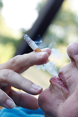 Image showing Senior smoking