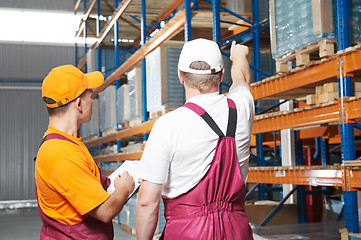 Image showing manual workers in warehouse