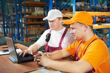 Image showing manual workers in warehouse