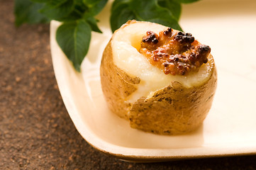 Image showing Baked potato with sour cream, grain Dijon mustard and herbs