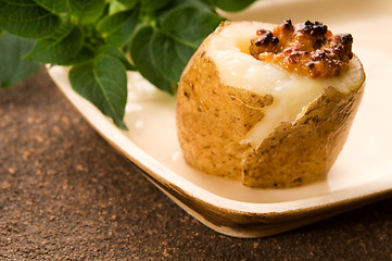 Image showing Baked potato with sour cream, grain Dijon mustard and herbs