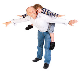 Image showing Grandfather giving grandson piggy-back