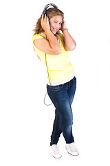 Image showing Cheerful caucasian woman listening and enjoying music