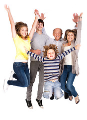 Image showing Happy family jumping high