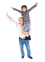 Image showing Grandfather giving grandson piggy-back