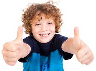 Image showing Smilling cute little boy gesturing thumbs up