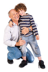 Image showing Grandfather embracing his grandson