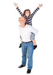 Image showing Grandfather giving grandson piggy-back