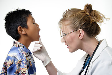 Image showing Child having a routine physical exam by doctor