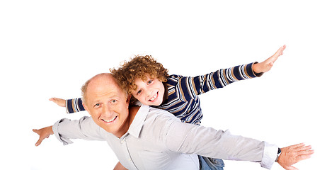 Image showing Grandfather giving grandson piggy-back