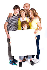 Image showing Portrait of a happy family holding a billboard
