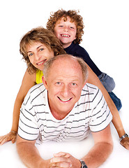 Image showing Grandparent lying on floor with grandson