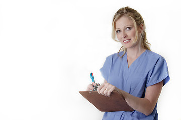 Image showing Friendly nurse holding chart