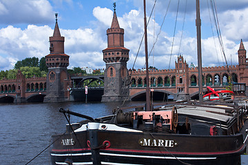 Image showing old ship in front of a bridge