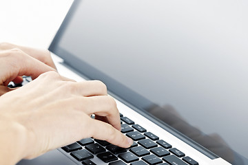 Image showing Hands typing on laptop keyboard