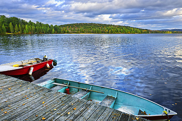 Image showing Rowboats on lake at dusk