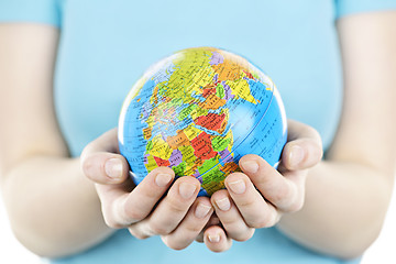Image showing Hands holding globe