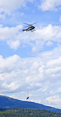 Image showing Rescue helicopter in mountains