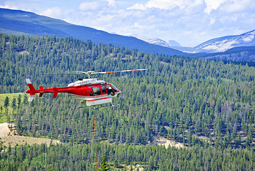 Image showing Rescue helicopter in mountains