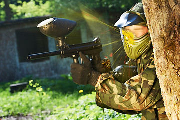 Image showing paintball player direct hit