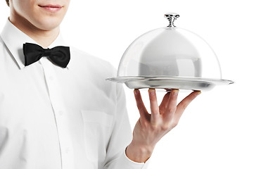 Image showing hand of waiter with cloche lid cover