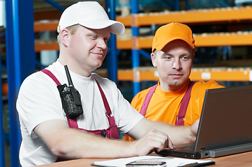 Image showing manual workers in warehouse