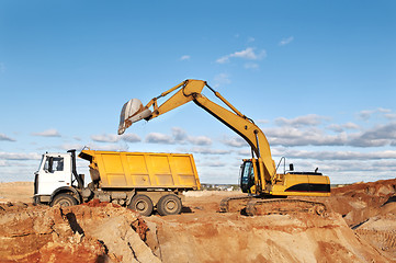 Image showing track-type loader excavator and tipper dumper