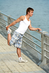 Image showing Stretching exercises before sport jogging