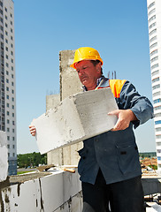 Image showing bricklayer at construction masonry works