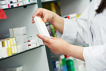Image showing closeup hand of chemist with drug