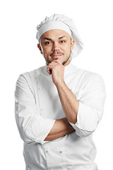 Image showing happy chef in white uniform isolated