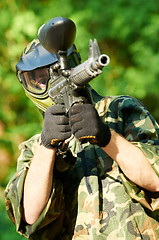 Image showing paintball player holding fire