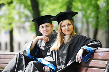 Image showing happy graduate students outdoors