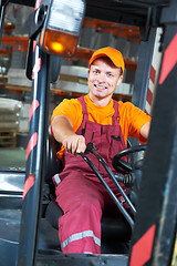 Image showing warehouse worker driver in forklift