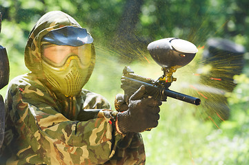 Image showing paintball player direct hit