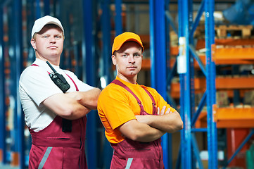 Image showing young manual workers in warehouse