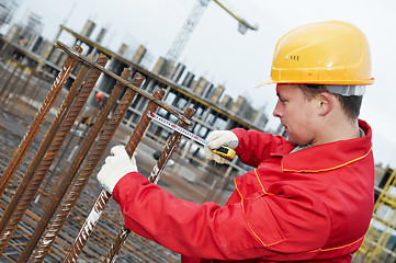 Image showing construction worker making reinforcement