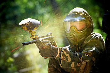 Image showing paintball player direct hit