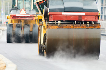 Image showing compactor roller at asphalting work