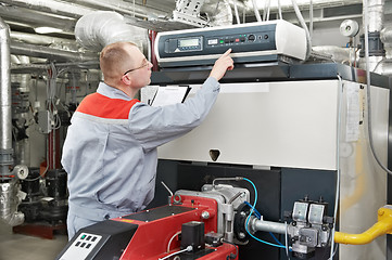 Image showing heating engineer in boiler room