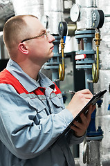 Image showing heating engineer in boiler room