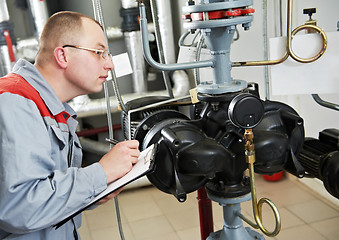 Image showing heating engineer in boiler room
