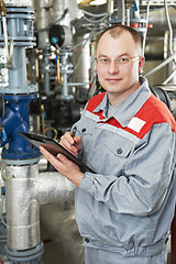 Image showing heating engineer in boiler room