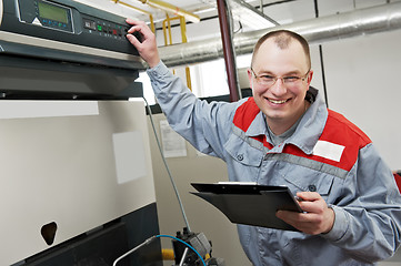 Image showing heating engineer in boiler room